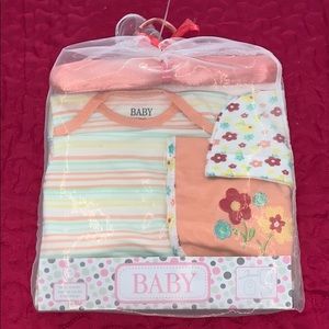 A baby set - hat, onesie, and a baby bib